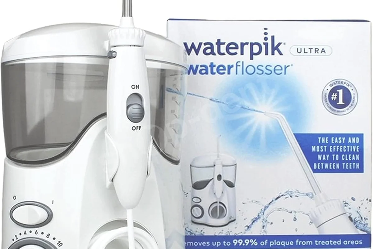 el waterpik wp100 ultra con su mango, el enrollacables y la caja